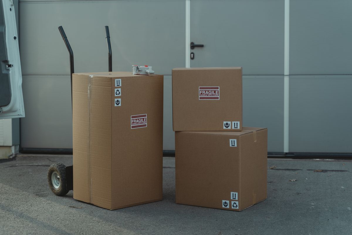 Packages ready for pickup outside a warehouse