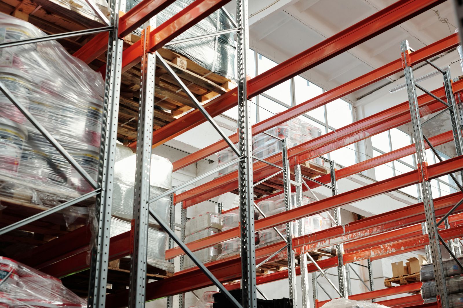 Rows of organized warehouse storage shelves